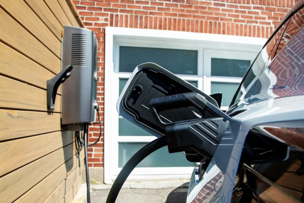 ev home Electric car plugged into home charging station